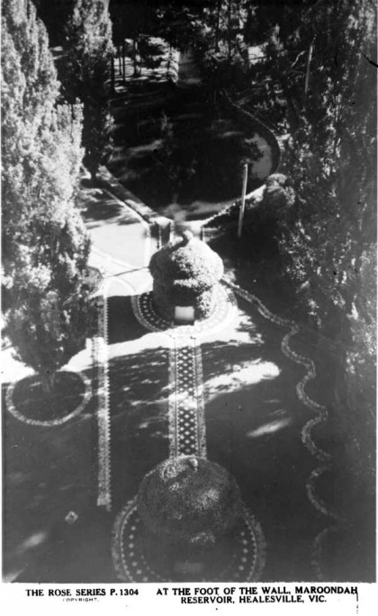 Postcard showing the two valve houses as viewed from the top of the dam wall, circa 1940s