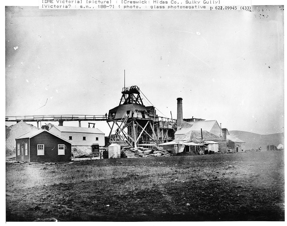 "Black and white photograph of wooden buildings used by a mining company in the 1880s""