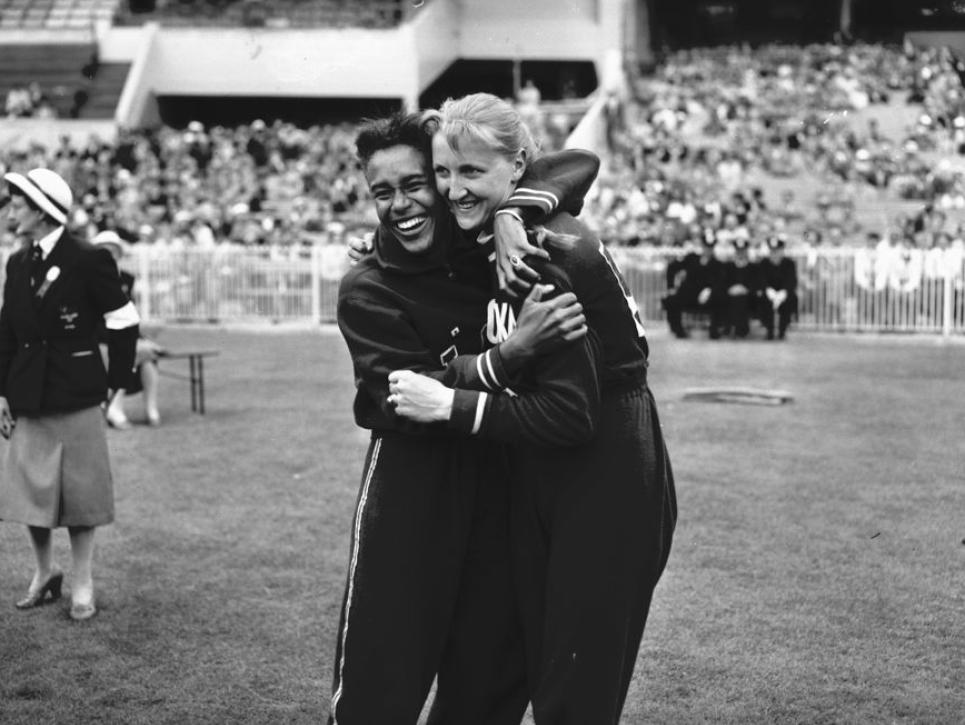 two athletes hug